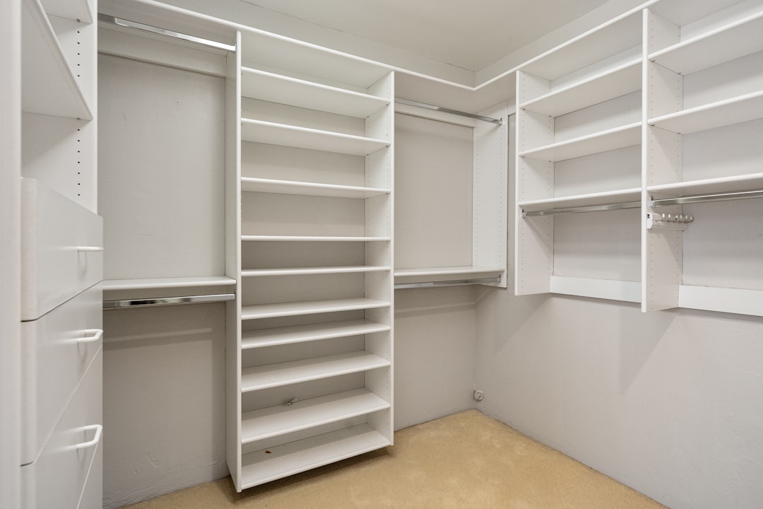 professionally organized pantry with clear bins and labels